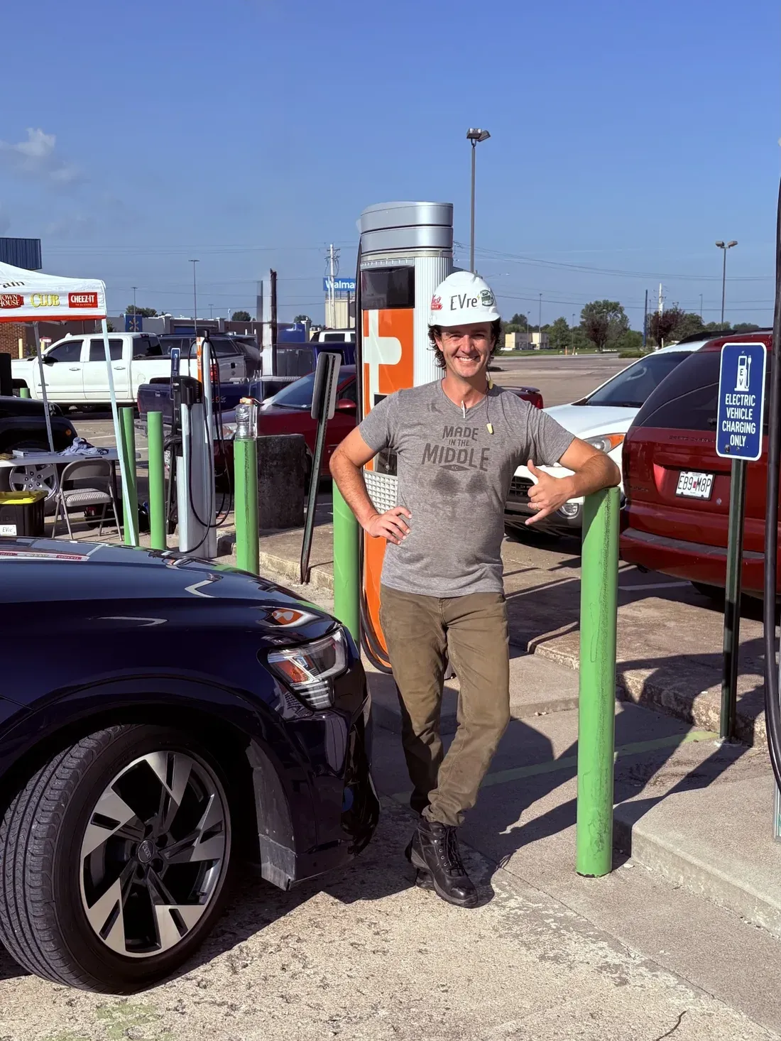 EVre engineer in a hardhat at a customer charging event