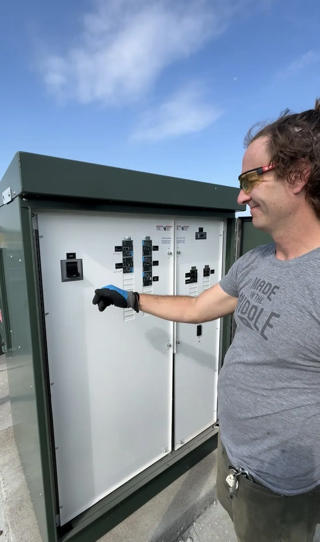 EVre engineer inspecting breakers inside a new main distribution switchboard